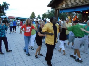 Al Morse dances with the crowd at Lake Sumter Landing Market Square. 