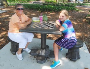 Emily Longstreet, 9, won the first checker game from Grandma Rose Butchko.