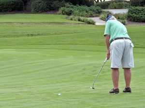 Doug Puvogel's winning putt drops into the hole that won the match for Tierra.