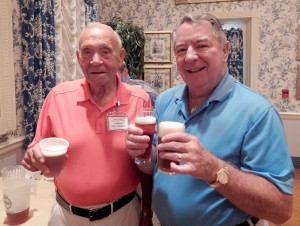 Walter Mollenhauser and Arthur Jenkins share a beer.