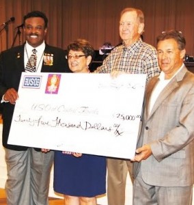 Harry Lumpkin, Jo Weber, Dick Phoebus and Roland Emerton, from left, with a $25,000 check from Rotary to the USO. 