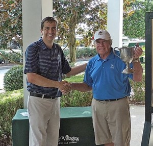 Evans Prairie Team Captain Russ Jimeson receivies the Village Cup Trophy from Ken Roshaven, PGA Professional Glenview Country Club.