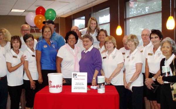 AIM volunteers pose with Nancy Lopez and Jo Geiger.