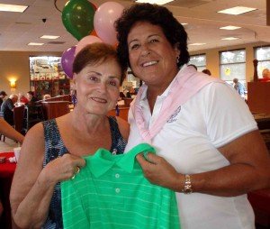 Catherine Hinton and Nancy Lopez who signed a shirt for Hinton's son. 