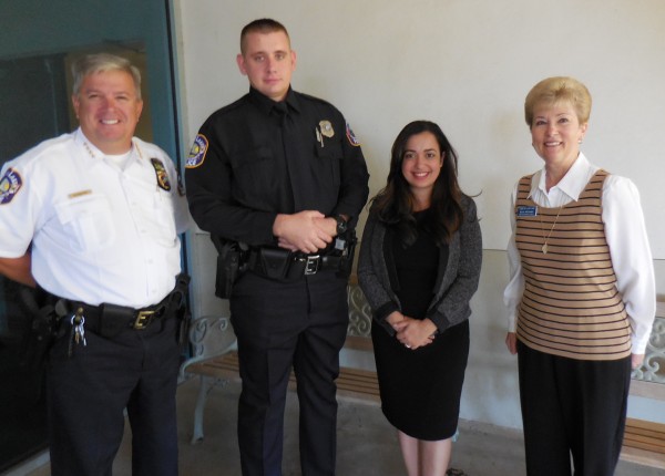 Lady Lake Police Chief Chris McKinstry, Officer Matthew Duryea, Christie Duryea and Mayor Ruth Kussard