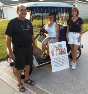 Golf cart winner Christine Bartow with Angelo and Renee Delmonte. 