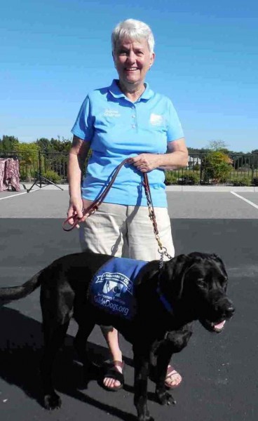 Villager Bonnie Gallagher with Patriot, an ambassador for Southeastern Guide Dogs.