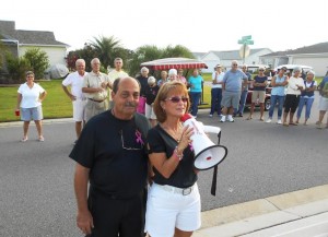 Renee Delmonte uses a bullhorn to address the crowd.