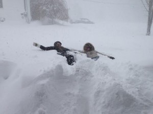 Abbie Pace and Emma RIccio make snow angels.