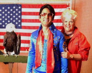 Head of the Villages Tea Party Aileen Milton with an Elvis impersonator and an Eagle.