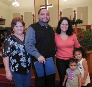 Edgardo Velazquez with his mother, sister, daughter and niece Sunday at the House of Hope graduation.
