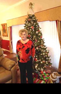 Margo Smith by the Christmas tree in her Village of Chatham home.