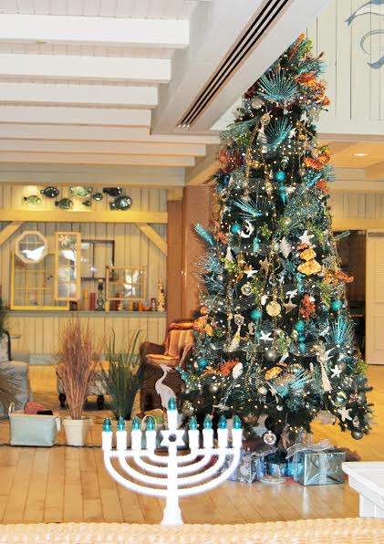 The Christmas tree at SeaBreeze Recreation Center, with the Menorah.