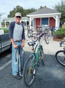 Wally Kurz works on bicycle.