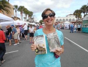 Alene Kraus of the Village of Fernandina shows off books she purchased.