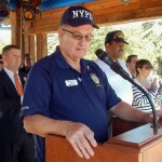 Mike Spalding, president of The Villages NYPD 10-13 club, addressed the crowd.