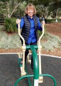 District Manager Janet Tutt tries out the exercise equipment.