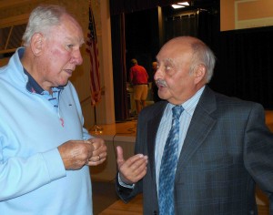CDD 8 Chair Sal Torname, right,  talks to a resident at the Town Hall meeting.