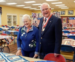 Don Doggett and his wife, Mary, admire the quilts.