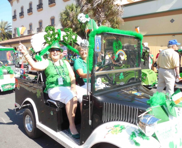 Jackie Campbell waves an Irish flag during Tuesday's parade. 