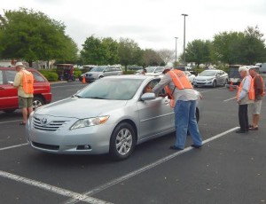 A driver and car are put through the CarFit process.