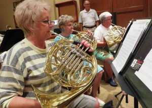 Members of the Villages Concert Band rehearse for this week's concerts.