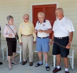 Carl Bell, center, makes the final connection in the gate connectivity project.