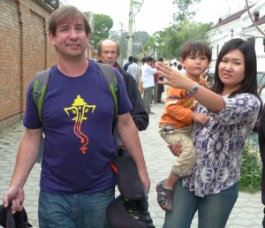 Villager Kelley Kaufman's son, Matthew Simmons, with his wife and son, as they make their way through Kathmandu after the quake. Ted Godlin is walking behind.