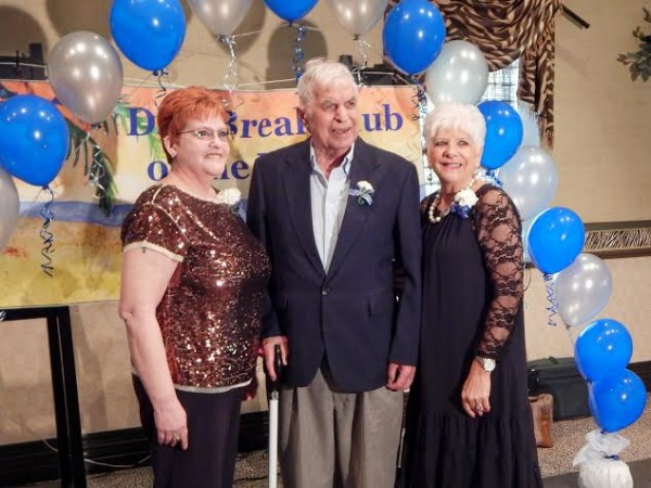 Dominick 'Doc' Nicometo had his souvenir photo taken flanked by Jan Roberts and his sister-in-law, Linda Nicometo.