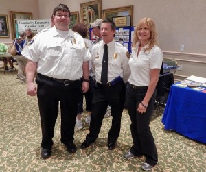Lt. John Longacre, Dan Hickey and Laurie Scheben of the Villages Public Safety Department.