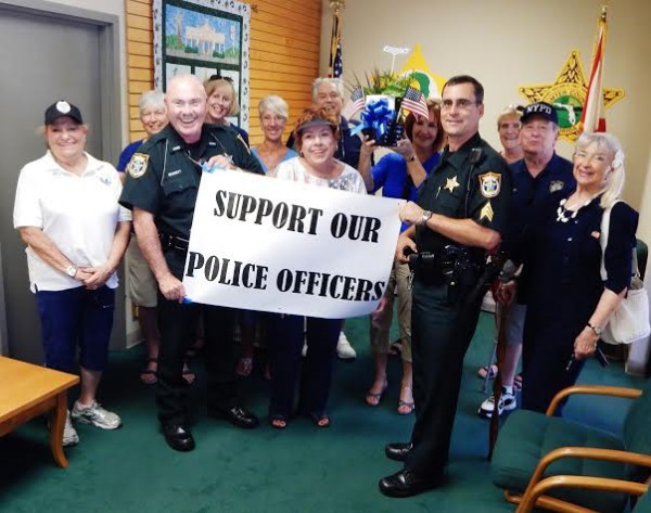 Deputy Dick Bennett and Sgt. Robert Siemer, of the Sumter County Sheriff's Office, were happy to meet with RFWTV's membership chair,Barbara Qualls, center, and others from the traveling contingent.