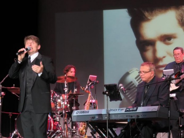 Clark Barrios on stage at Savannah Center.