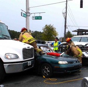 Firefighters work to extricate those trapped in vehicles in the accident.