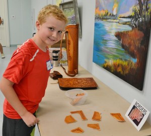 Gavin Grogan, 10, took a few minutes to choose a border pattern for his wallet.