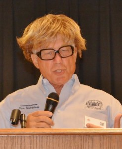 Don Hahnfeldt wears a wig and glasses to mock Hillary Clinton.