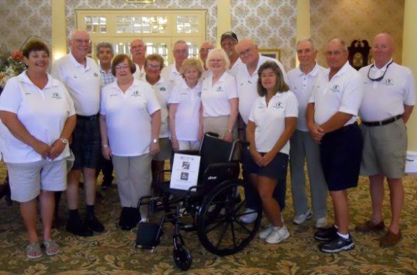 Members of the Community Improvement Council donate the first wheelchair