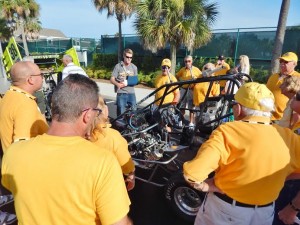 Kenny Brewer enjoyed discussing the intricacies of race car steering with club members.