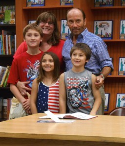 Lee Greenwood poses with Donya Broda and her children, Michael, McKenzie and Matthew.