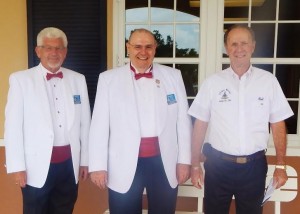 Larry Kent, David Dix and Bob Moynihan posed by The Villages Charter Elementary School's 4th and 5th ​grade building.