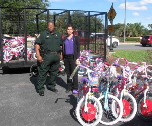 Lt. Nehemiah Wolfe in December 2013 with some of the bicycles for area children at Christmas.