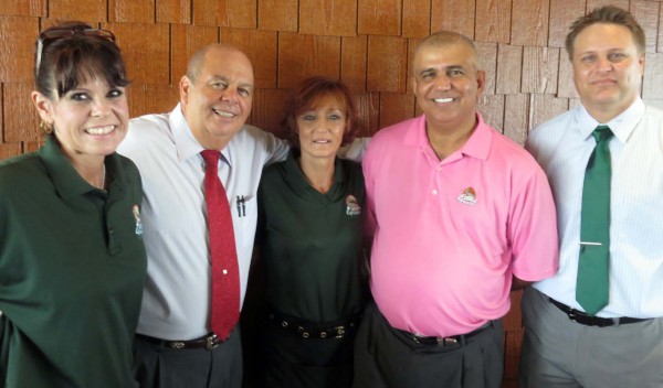 Part of the Evans Praire County Club community, from left, Rhonda Friend, Paulie Villareal, Dana Johnson, owner Fred Karimipour and Jon McNeeley.