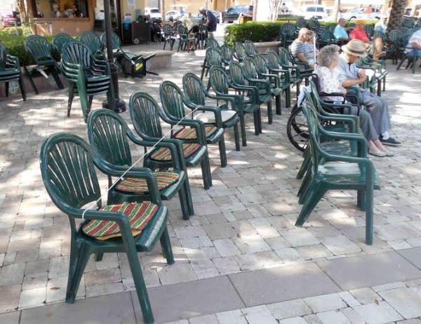 A row of seats is marked off with rope and cushions at Spanish Springs Town Square.