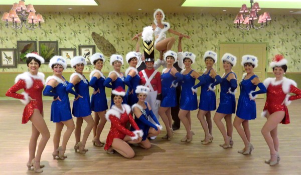 Dancers are prepping for a Rockette-style Christmas show.