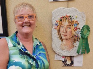 Fernandina Villager, Connie Giacobbie's, Italian Mosaic,​ inspired by Botticelli's Primavera, received an honorable mention.