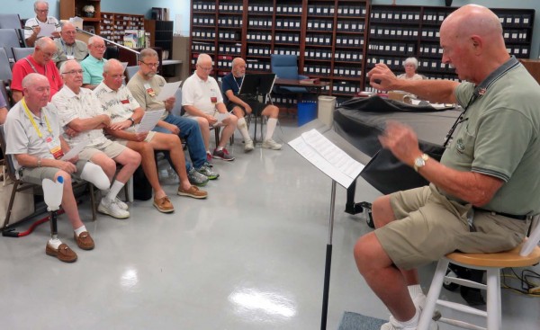 Scott Werner directs the chorus in rehearsal.