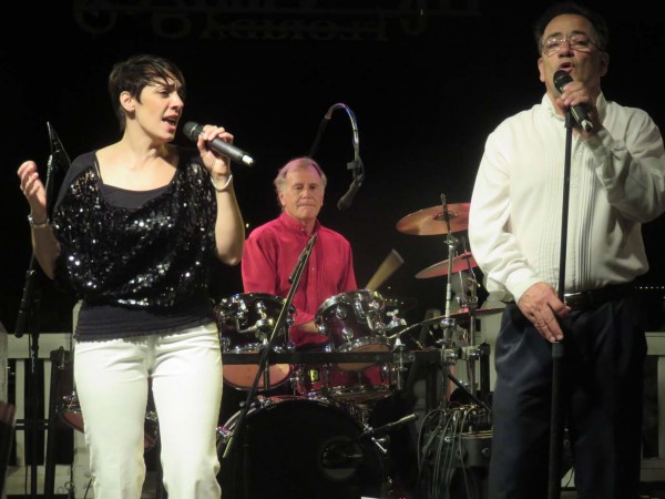 Dawn DiNome and Ralph DiNome sing as Ted Skolits plays drums at Lake Sumter Landing,