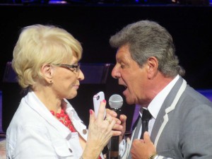 Frankie Avalon sings to a fan in the audience at The Sharon.