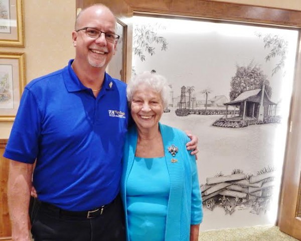John Rohan posed with the most senior muralist, Freddie Venturoni, 92, and her rural Brownwood mural.