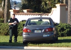 A deputy gathers information this morning at the scene of the crash.