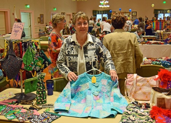 Suzy Golden of the Village of Buttonwood, and a member of the Seabreeze Quilters, shows off a couple of her quilted jackets.